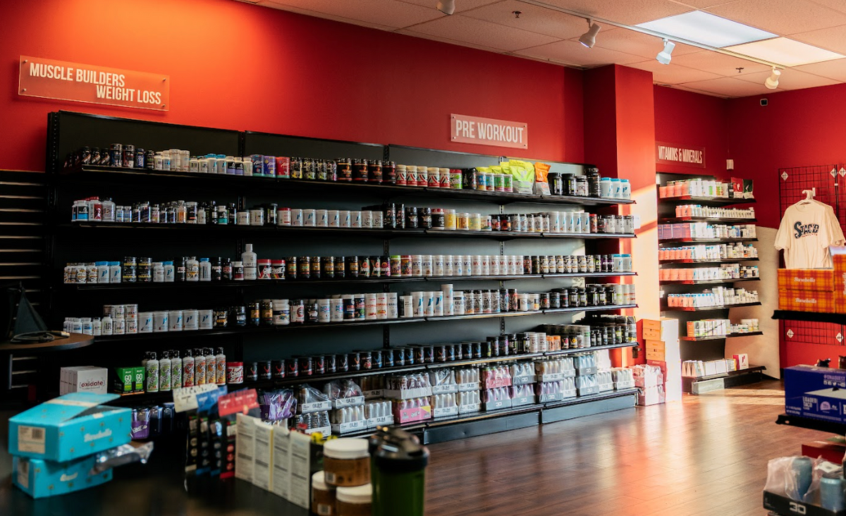 STACK'D Supplements staff offering expert in-store guidance